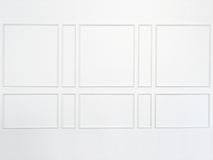 Brooklyn Estate peel and stick wall moulding kit featuring alternating large and narrow panels for 14'–21' walls. Fully assembled real wood frames made by carpenters in the USA.