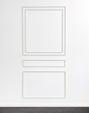 Self-adhering wall moulding kit featuring a double-panel design with middle moulding, perfectly proportioned for 10'–11' ceilings. Handcrafted from real wood in the USA.