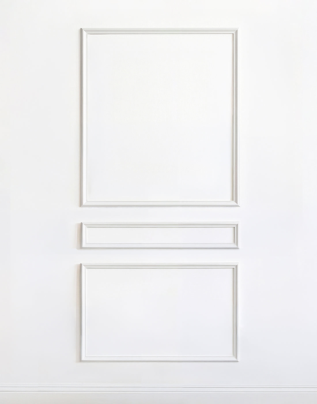 Self-adhering wall moulding kit with three fully assembled frames, perfectly proportioned for 10'–11' ceilings. Handcrafted from real wood in the USA.