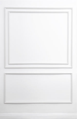 Removable and reusable self-adhering wall moulding kit featuring layered double-panel design with nested inner frame, handcrafted from real wood in the USA. Renter-friendly with complimentary replacement adhesive.