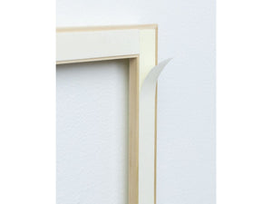 Close up picture of back of real wood moulding frame showing adhesive for easy application for Brooklyn Estate Wall moulding Kit Stain Grade