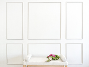 Fully assembled Brooklyn Signature Six Piece wall moulding kit installed as a balanced accent wall with a wider center panel and flanking side panels.