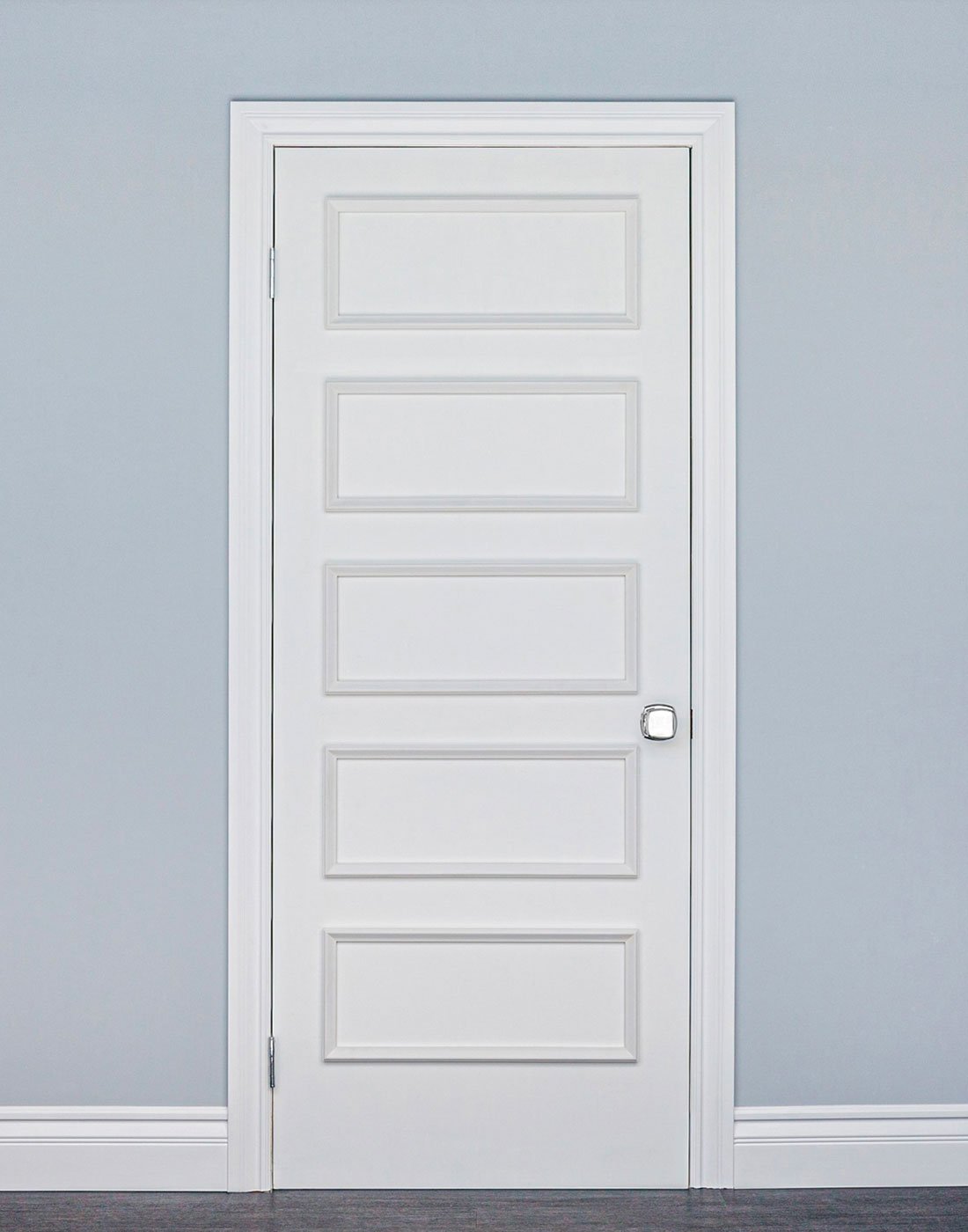 Removable retro door moulding installed on flat white rental door