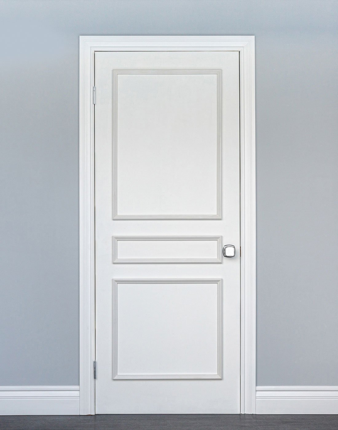 Removable three piece door moulding kit on white interior door