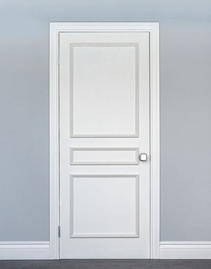 Removable three piece door moulding kit on white interior door