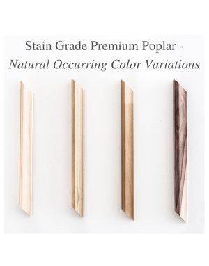 Natural color variations in stain grade premium Poplar wall moulding — from light cream to warm tan to deep charcoal, showing real wood grain differences